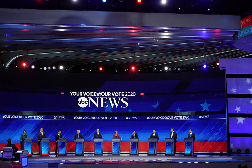 From left, Democratic presidential candidates Sen. Amy Klobuchar, D-Minn., Sen. Cory Booker, D- ...