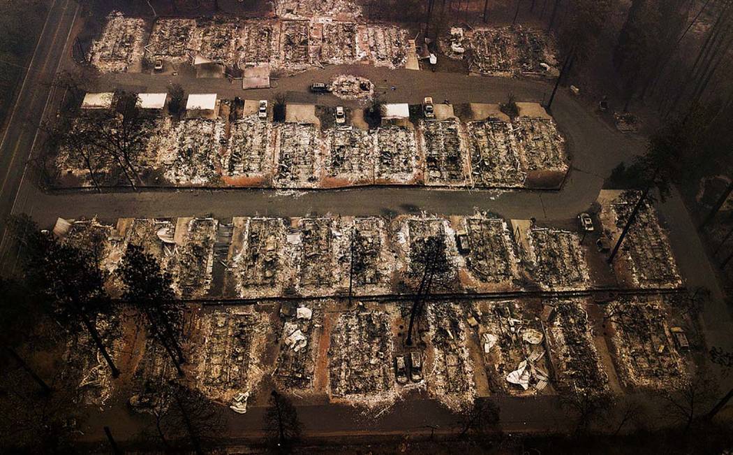 This Nov. 15, 2018, aerial file photo shows the remains of residences leveled by the Camp wildf ...