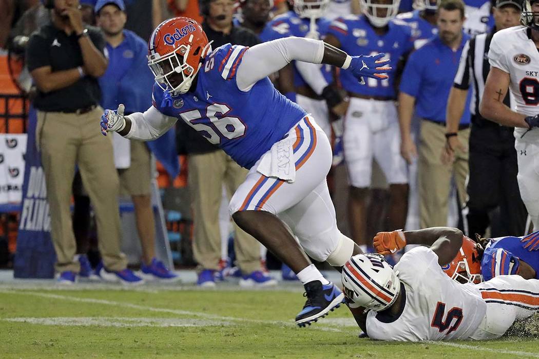 Florida defensive lineman Tedarrell Slaton celebrates after making a tackle on UT Martin runnin ...