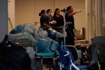 Hospital employees work next to medical equipments at the Badim Hospital, where a fire left at ...