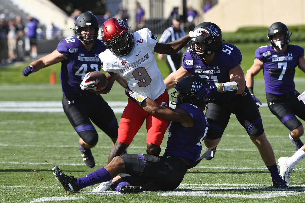 UNLV wide receiver Tyleek Collins (9) runs against Northwestern linebacker Paddy Fisher (42), l ...