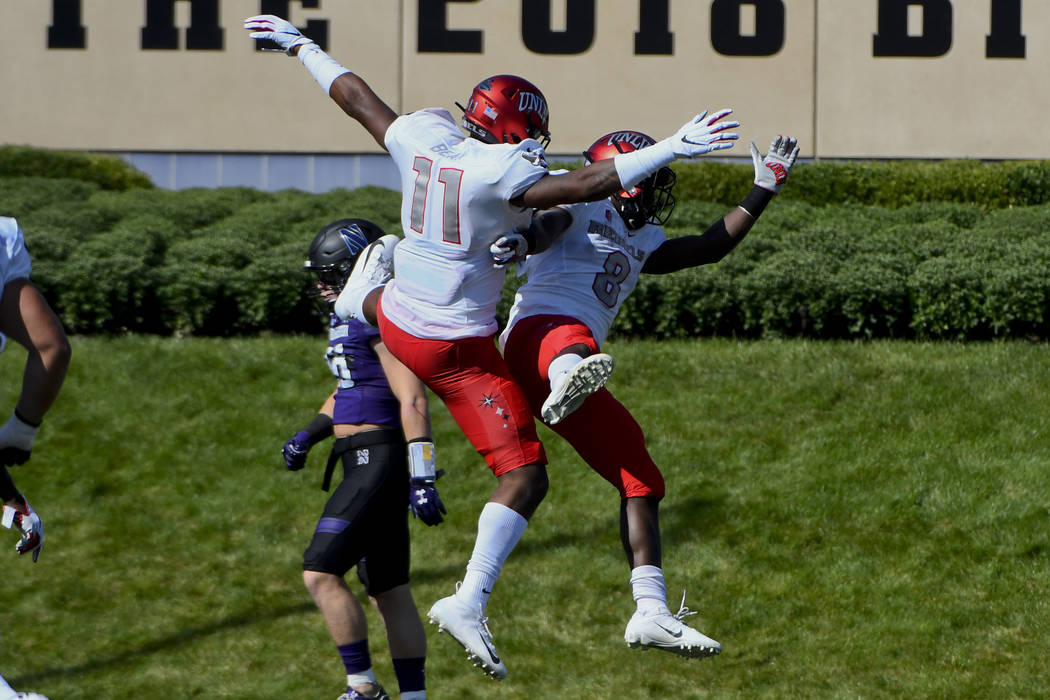 UNLV tight end Noah Bean (11) and running back Charles Williams (8) celebrate after Williams ra ...