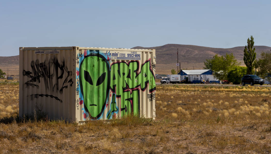 A storage container with alien and Area 51 markings sits across the street from the Little A'Le ...