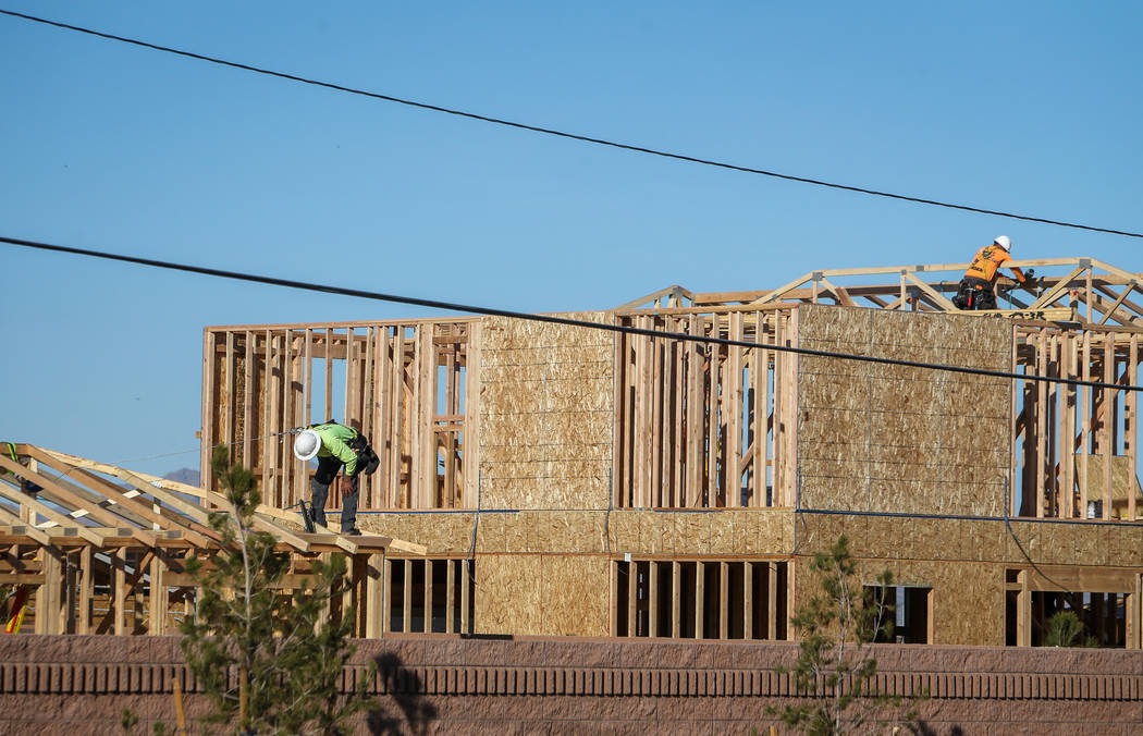 Construction under KB Home continues at the Desert Mesa neighborhood in North Las Vegas, Monday ...