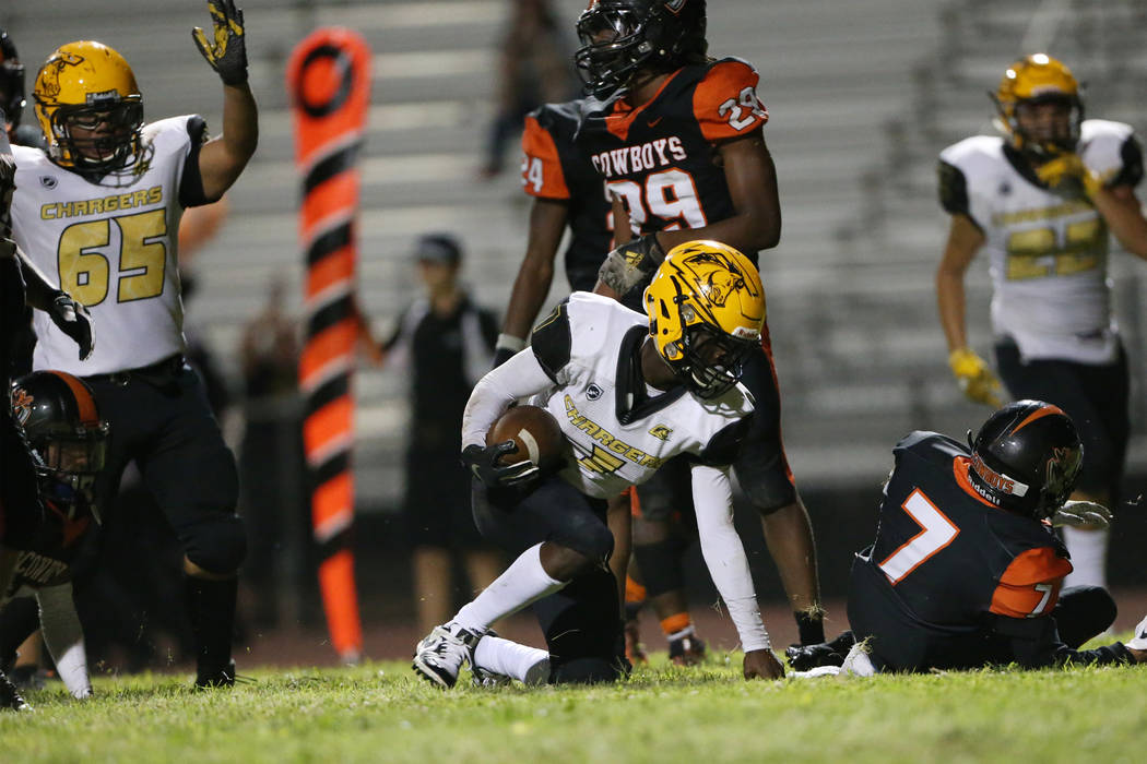 Clark's Elijah Caver (1) runs the ball for a touchdown against Chaparral's Nicholas Gaddy (7) i ...