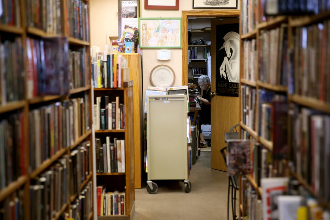 Myrna Donato, owner of Amber Unicorn Books at 2101 S. Decatur Blvd. in Las Vegas, works in her ...