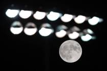 The Harvest Moon rises behind the field light during a game between Clark and Chaparral at Chap ...