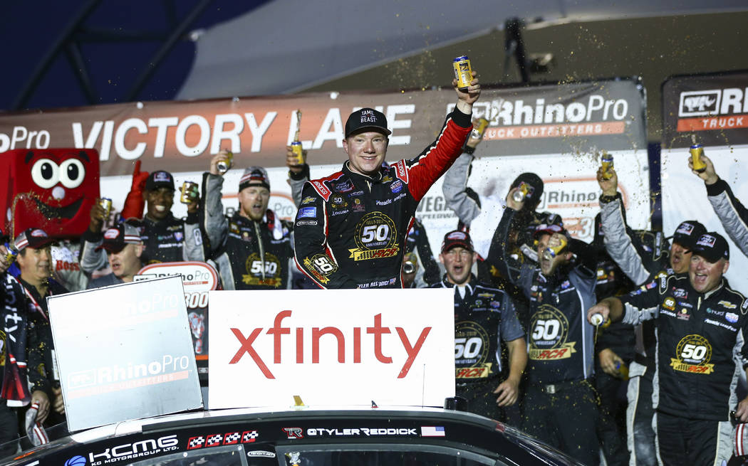 Tyler Reddick, center, celebrates after winning a NASCAR Xfinity Series auto race at Las Vegas ...