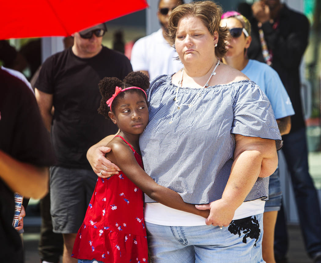 Tabatha Bissen, right, hugs her granddaughter, Chanel Bissen, 9, during a rally to protest the ...