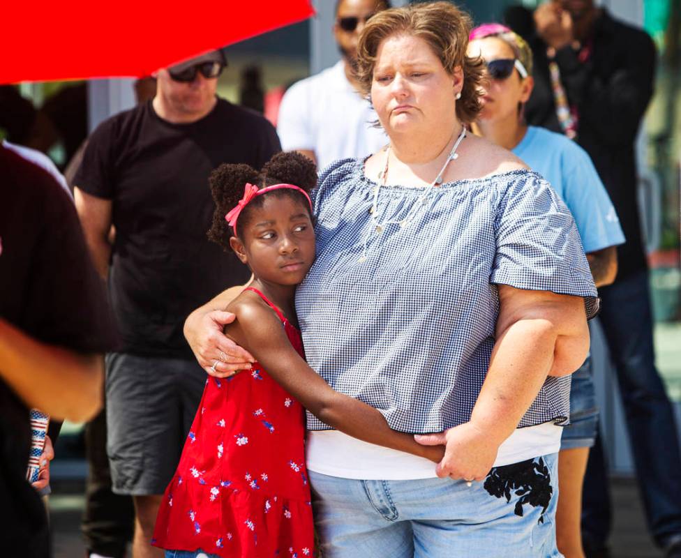 Tabatha Bissen, right, hugs her granddaughter, Chanel Bissen, 9, during a rally to protest the ...