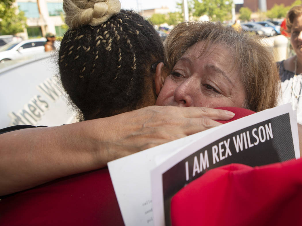 Alma Chavez, left, whose son, Rafael Olivas, was shot by Las Vegas police officers in 2011, hug ...