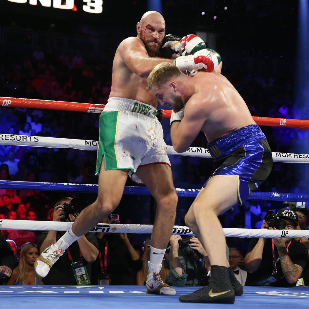 Tyson Fury, left, battles Otto Wallin in the third round of the heavyweight bout at T-Mobile Ar ...