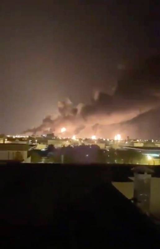 Smoke fills the sky at the Abqaiq oil processing facility on Saturday, Sept. 14, 2019 in Saudi ...