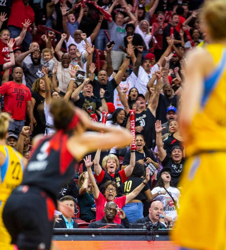 Fans go crazy after Las Vegas Aces forward Dearica Hamby (5) makes a late-game three-point-shot ...