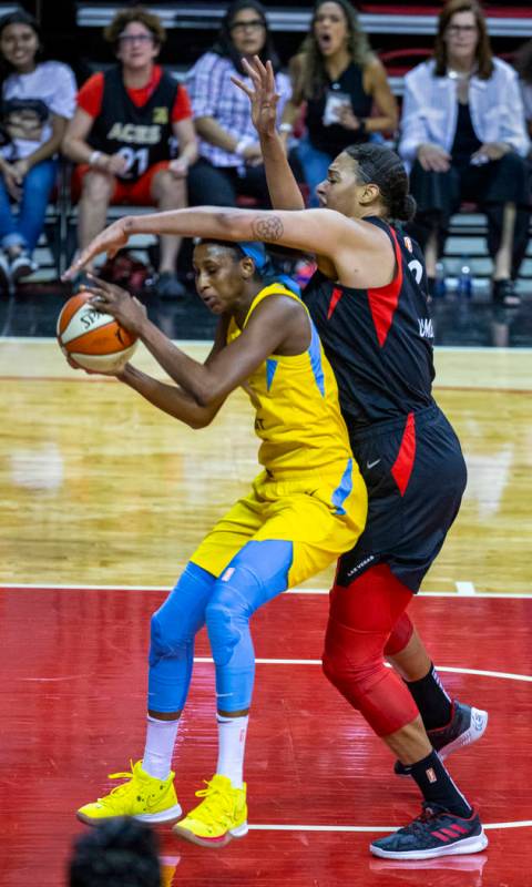 Chicago Sky center Astou Ndour (45) is defended well by Las Vegas Aces center Liz Cambage (8) d ...