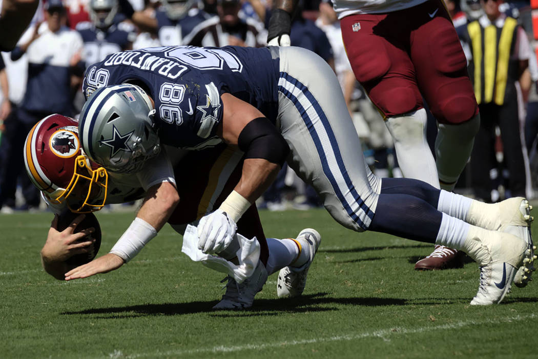 Dallas Cowboys defensive tackle Tyrone Crawford (98) sacks Washington Redskins quarterback Case ...