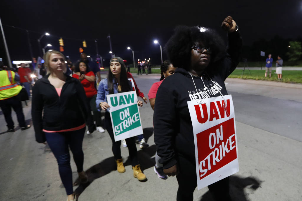 United Auto Workers members picket outside the General Motors Detroit-Hamtramck assembly plant ...