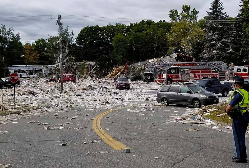 A police officer stands guard, Monday, Sept. 16, 2019, at the scene of a deadly propane explosi ...