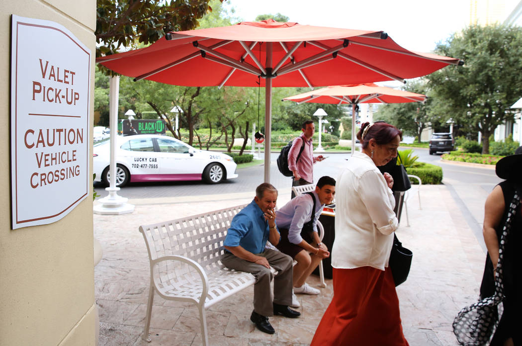 Hotel guests at Wynn Las Vegas wait for their cars at valet parking pick-up area on Monday, Sep ...