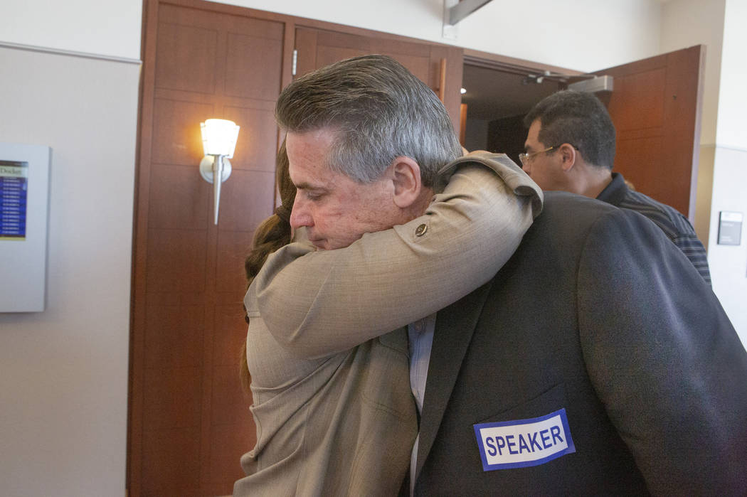 Retired Metro sergeant Steven Meriwether hugs Kelly Brewer after her son Alexander Brewer was s ...