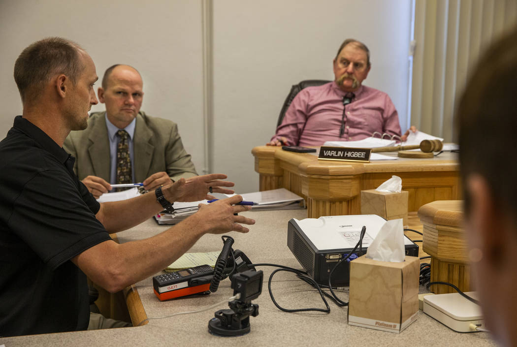 Fire Chief Eric Holt, left, as coordinator the Lincoln County Emergency Management team address ...