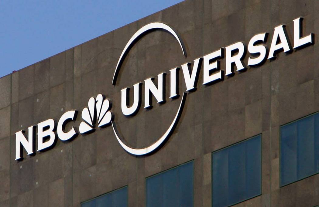 This Dec. 3, 2009, file photo, the NBC Universal logo hangs on a building in Los Angeles. Comca ...