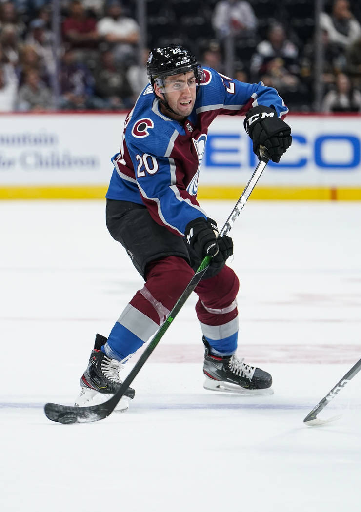 Colorado Avalanche defenseman Conor Timmins (20) takes a shot on goal against the Vegas Golden ...