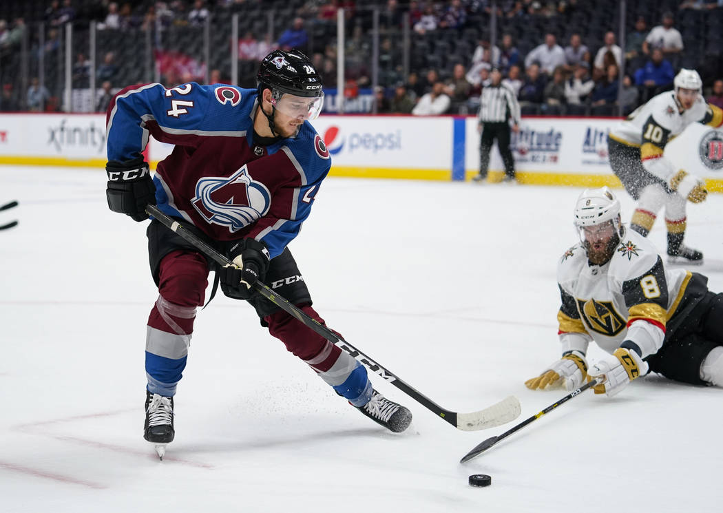 Colorado Avalanche left wing A.J. Greer (24) moves the puck past Vegas Golden Knights defensema ...