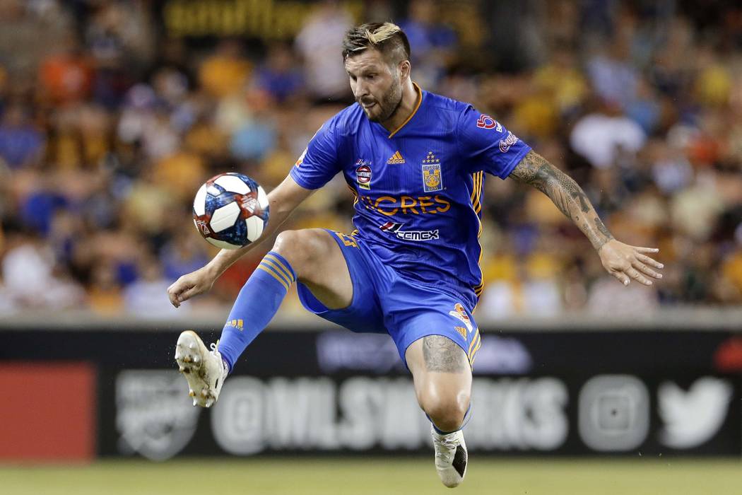 Tigres' Andre-Pierre Gignac jumps to bring down the ball during the second half of a UANL Leagu ...