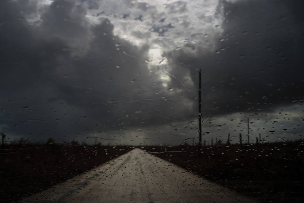 Rain drops cover a car's window shield prior to the arrival of a new tropical depression, that ...