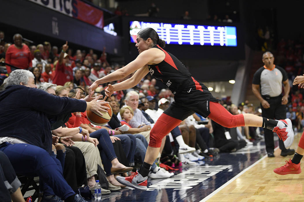 Las Vegas Aces guard Kelsey Plum chases a ball that went out of bounds, during the first half a ...