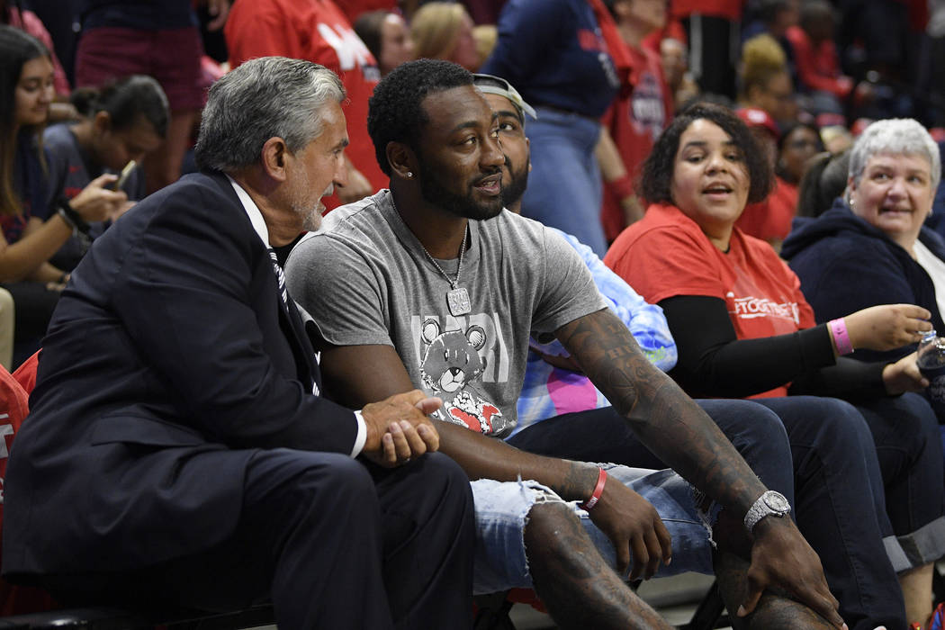 Washington Mystics and Wizards owner Ted Leonsis, left, talks with Wizards' John Wall during a ...