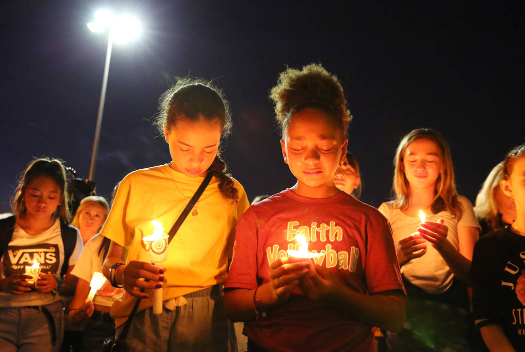 Monet Garcia's schoolmates gather at the Sobe Ice Arena during a candlelight vigil for Mark Gar ...