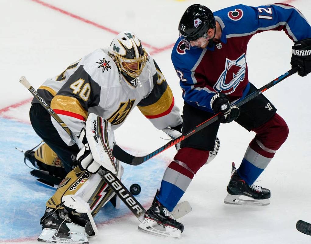 Vegas Golden Knights goaltender Garret Sparks (40) blocks a shot by Colorado Avalanche center J ...