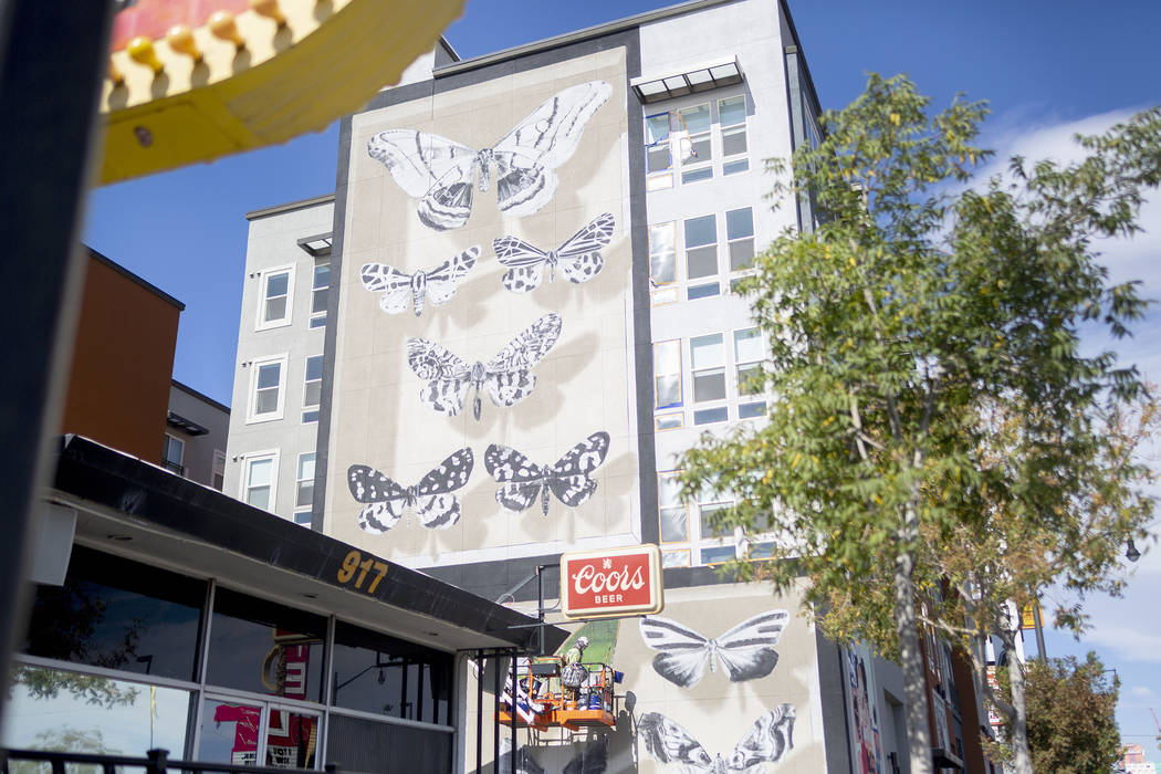 French painter Mantra works on his mural in preparation for Life is Beautiful music festival in ...