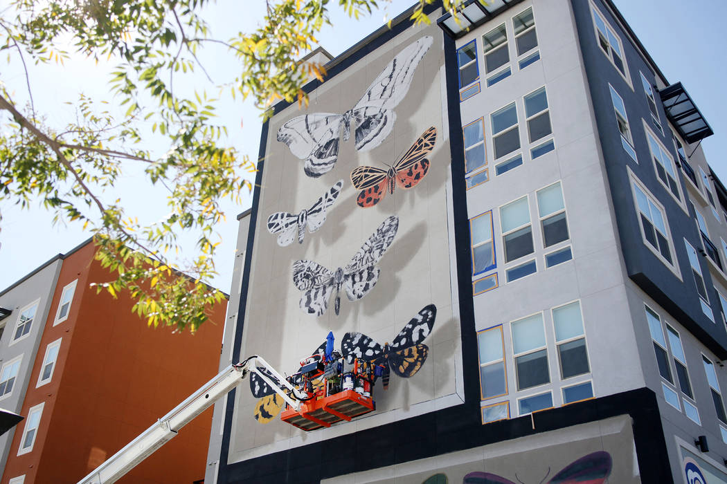 French painter Mantra works on his mural in preparation for Life is Beautiful music festival in ...