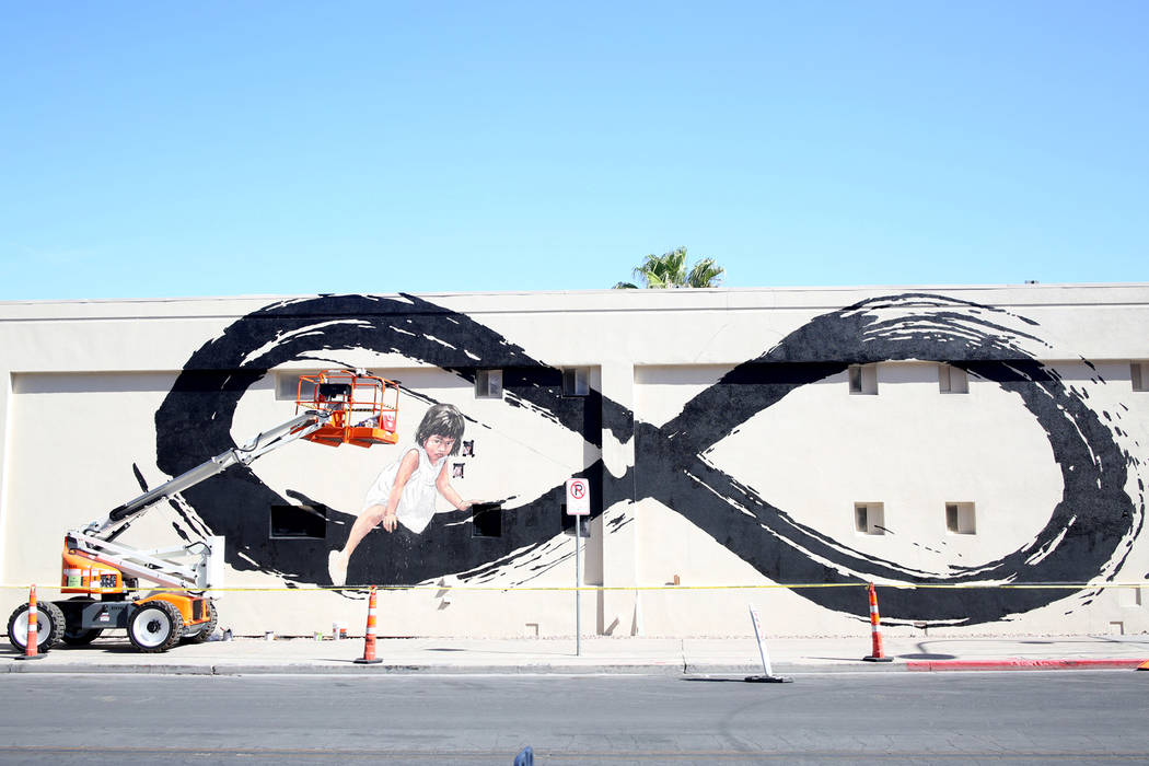 Lithuania artist Ernest Zacharevic's mural in progress in preparation for Life is Beautiful mus ...