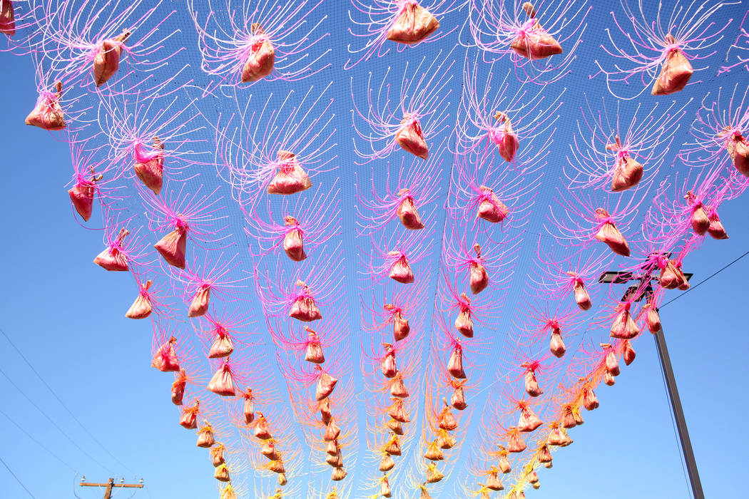 A colorful yarn installation created by Hot Tea is hung in preparation for Life is Beautiful mu ...