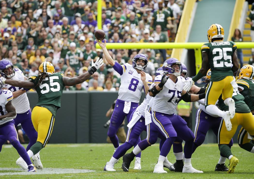 Minnesota Vikings' Kirk Cousins throws during the second half of an NFL football game against t ...