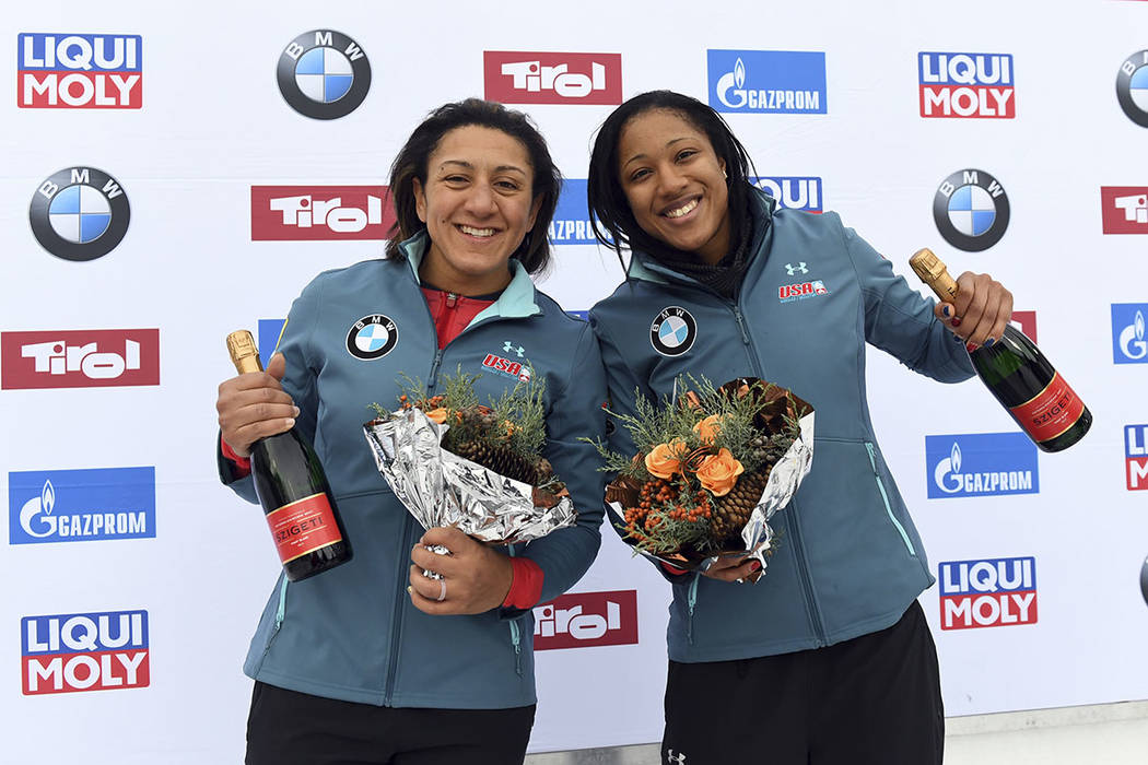 Elana Meyers Taylor, right and Sylvia Hoffmann from the United States celebrate their third pla ...