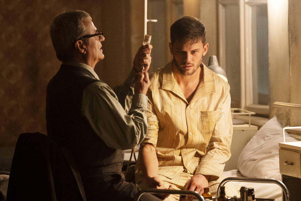 TREADSTONE -- Episode 101 -- Pictured: (l-r) Martin Umbash as Dr. Meisner, Jeremy Irvine as J. ...