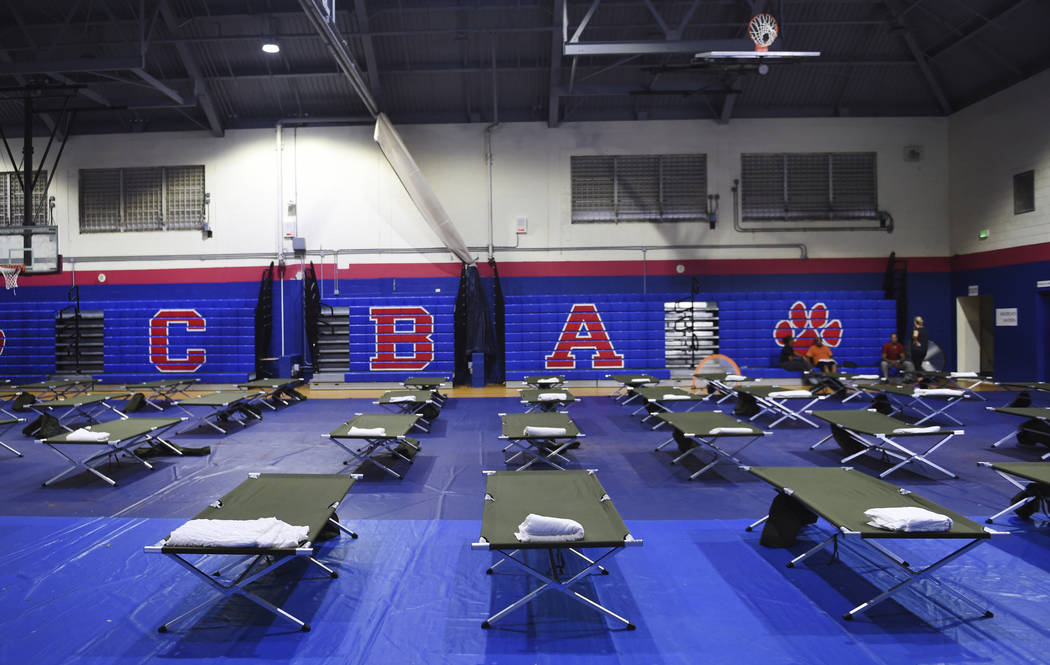 Cots fill the gym at Cedarbridge Academy which will be used as a shelter during the passing of ...