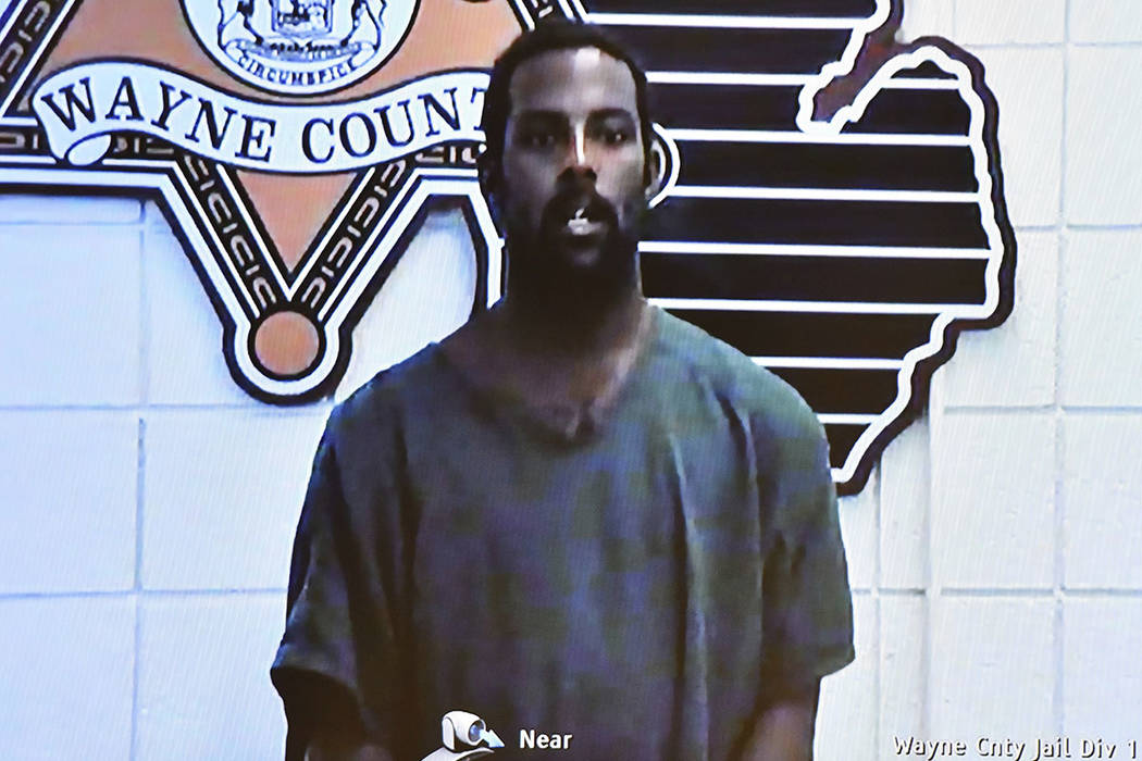 Deangelo Martin is displayed on a monitor during his video arraignment at 36th District Court, ...