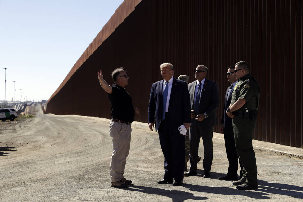 President Donald Trump tours a section of the southern border wall, Wednesday, Sept. 18, 2019, ...