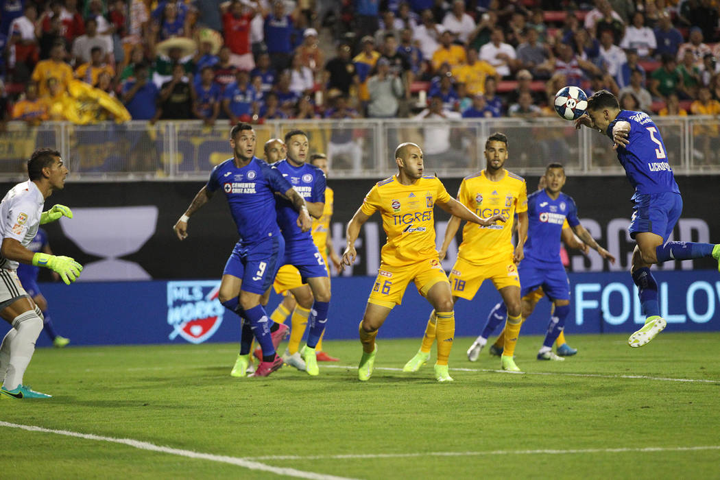 Cruz Azul's Igor Lichnovsky (5) heads the ball wide of the goal against Tigres during the first ...