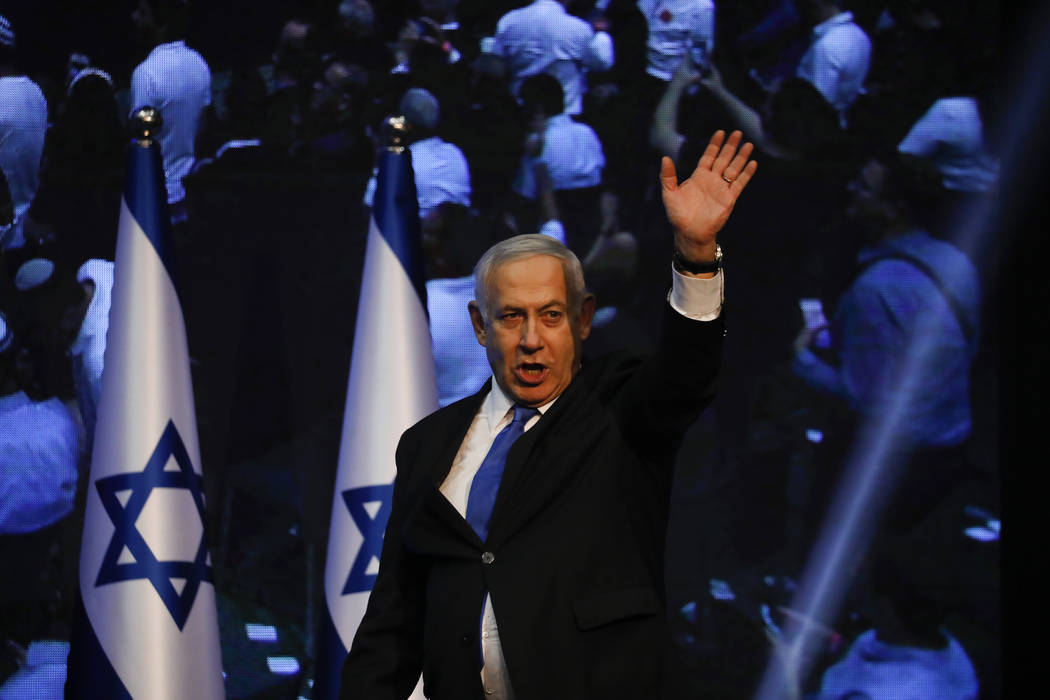 Israeli Prime Minister Benjamin Netanyahu addressees his supporters at party headquarters after ...