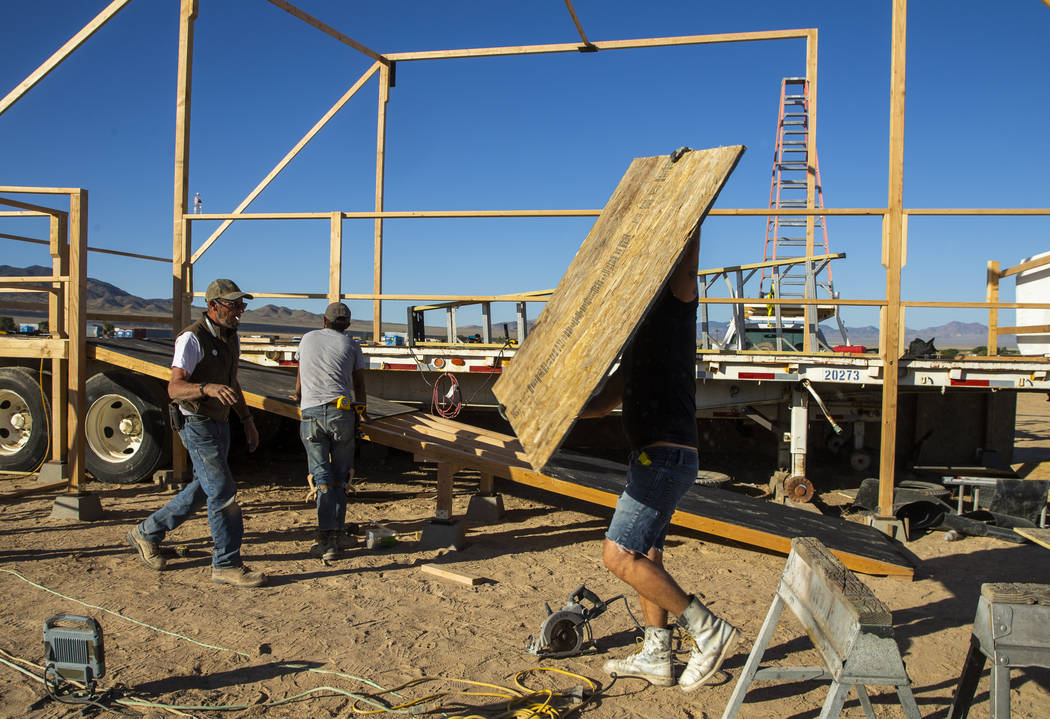 The construction crew begins work on finishing the main stage as the start of the Alienstock fe ...