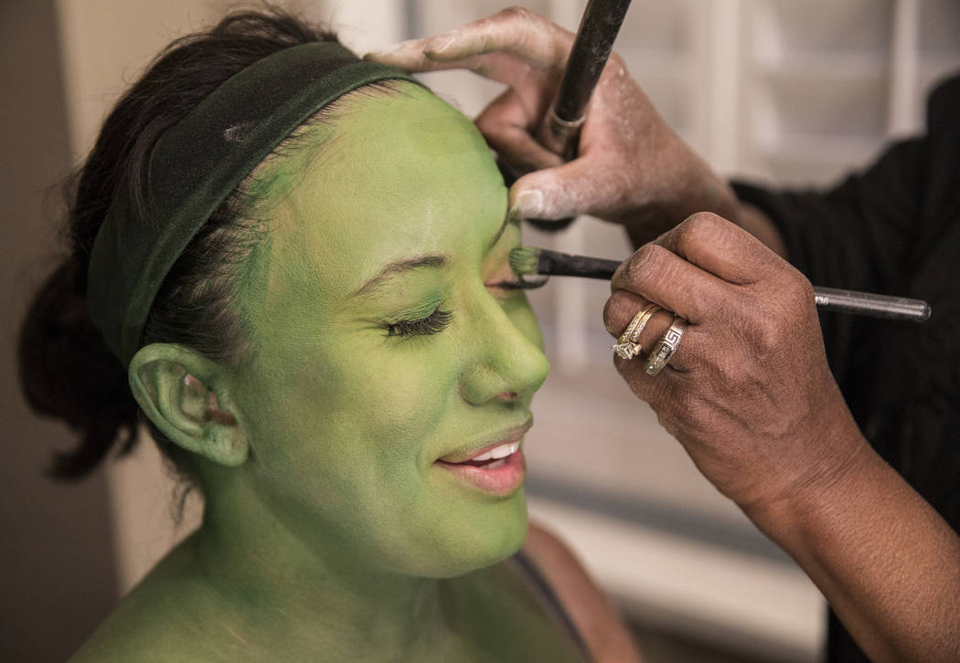 Mariand Torres, who plays Elphaba in "Wicked," gets her makeup done before the show at The Smit ...