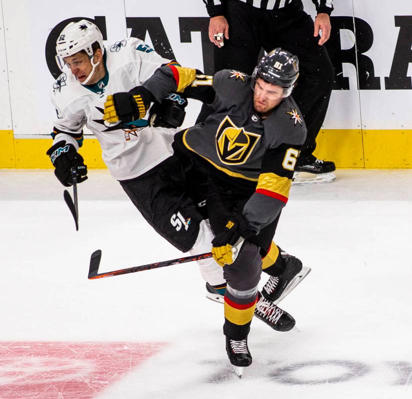 San Jose Sharks center Lukas Radil (52) collides with Golden Knights right wing Mark Stone (61) ...