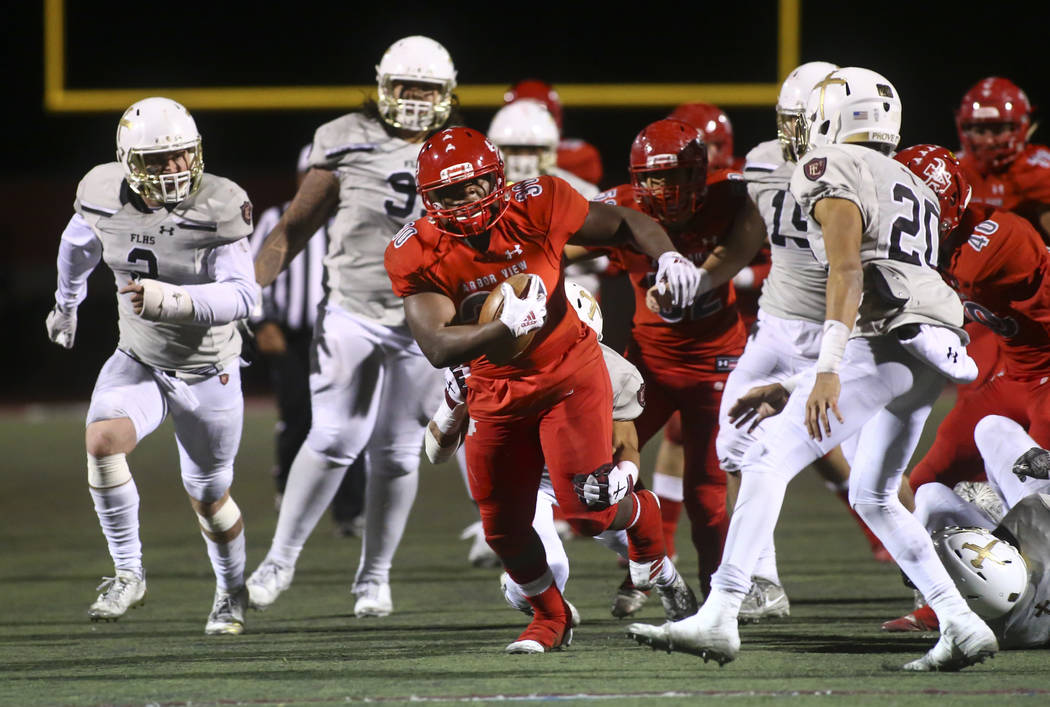 Arbor View's Darius Williams (30) runs the ball against Faith Lutheran during the second half o ...